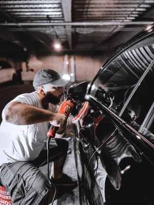 One of our employees doing a paint correction on a customers vehicle.