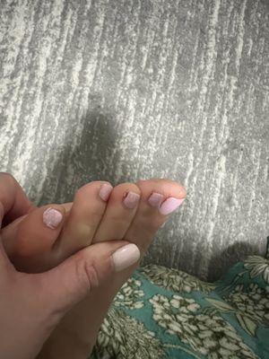 Middle toes have my old dark polish in the left corner. pinky toe (the one she did half of initially) has polish not cleaned up on my skin.