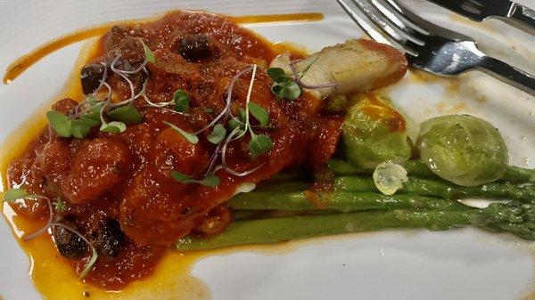 Grouper with a tomato sauce and olives