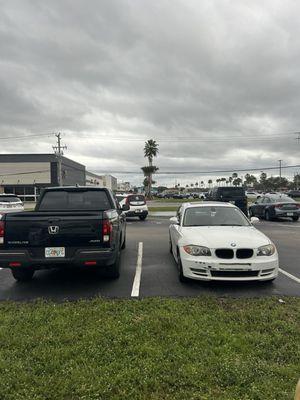 Here is my car before palmbay collision repair fixed it up! The one on the right! BMW