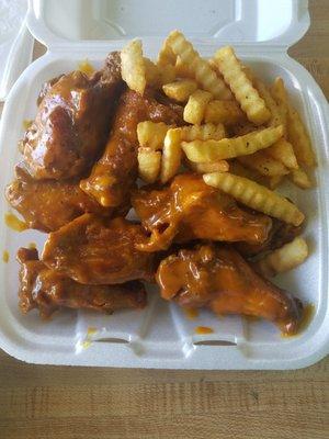 10 large wings and fries in a Caribbean barbeque sauce