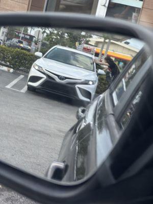 The employee hanging at her friends window while I waited for my order