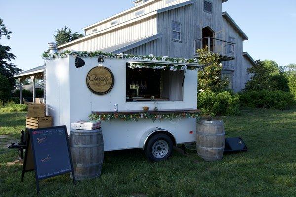 The bar is set up and ready to serve at an outdoor event!