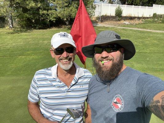 Me and Dad at the 9th hole.