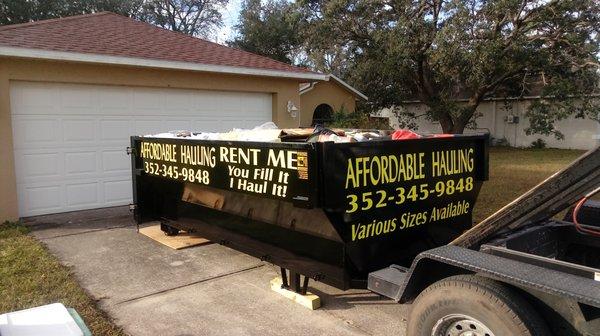 Easy loading 12 yard dumpster for garage clean out