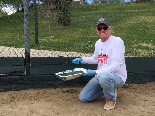 Joseph H. Saunders on a community service project to rehab youth baseball fields.