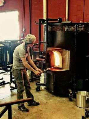 gathering hot glass out of a 200 lb furnace