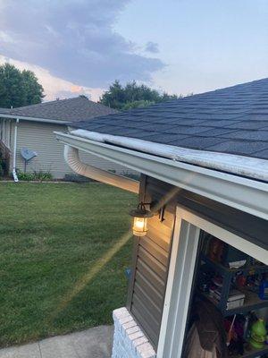 The row of gutter guards NAILED to the roof.