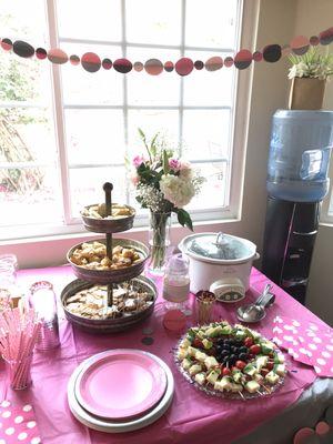 Matching table settings and hand sewn 3D circle garlands for a "Baby Sprinkle" baby shower.