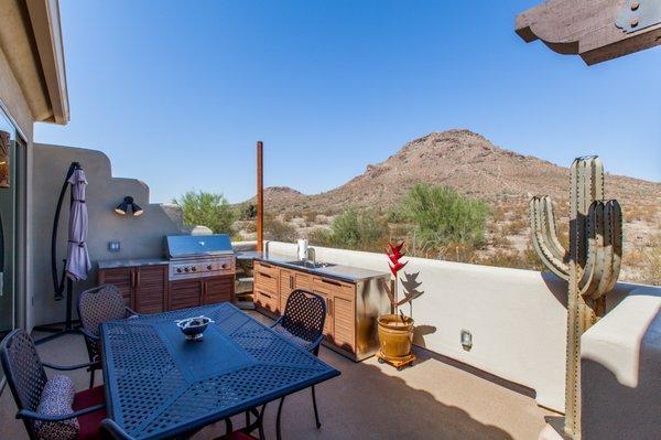 We maximized outdoor living areas with this Deck Renovation and Storage Room Two-Story Addition in North Phoenix.