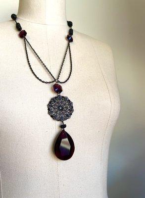 Artist: LeeAnn Schock
Vintage deep purple chandelier crystals, black glass beads and repurposed black chains.