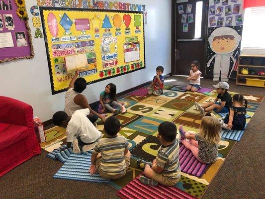 Reading time after music & movement class for some of our preschoolers