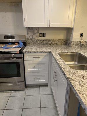 Kitchen cabinets and granite installation