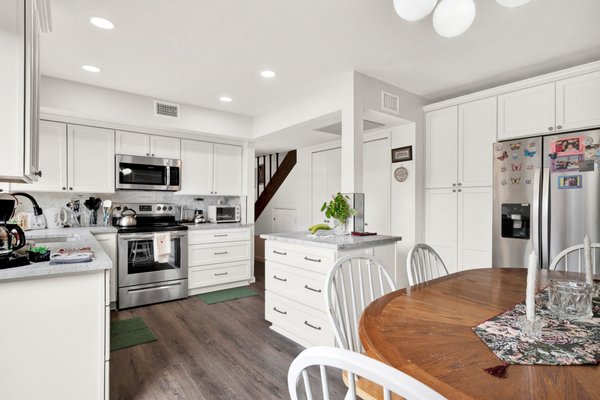 Kitchen redesign / remodel with all wood cabinets, pull outs, granite countertops, under mount sink, vinyl plank flooring and all new paint.