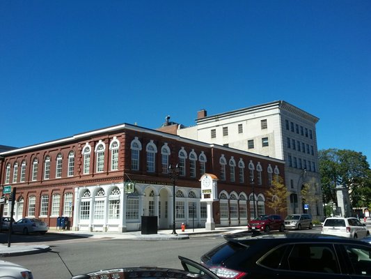 Beautiful historic building in downtown Concord next to Bank of New Hampshire Building in white.