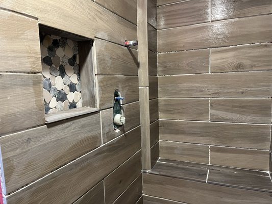 Custom built walk-in tile shower.  Niches, hand-held wands, and overhead rain faucets adorned this Bethlehem beauty