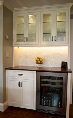 Built-in bar with overhead cabinet and Wine Fridge.