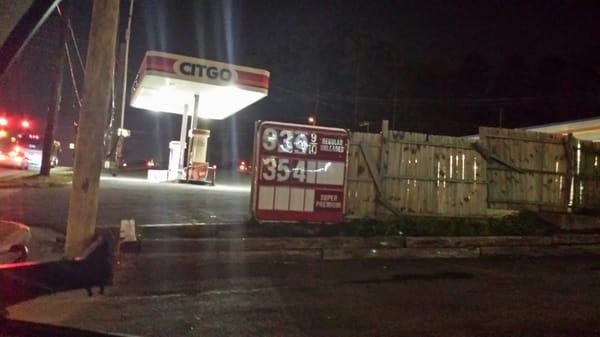 The remains of the sign strapped to a fence.