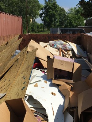 Dumpster after a job, filled to the brim.