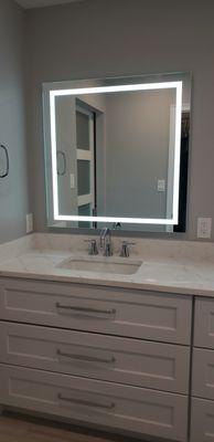 The drawers under the sink were modified to accommodate the sink and plumbing while preserving drawer space