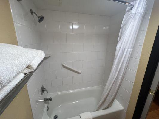 Picture of King Suite (non-smoking, like all their rooms are) bathroom showing the ~ just around 8-12 inches depth bathtub, excellent qualit