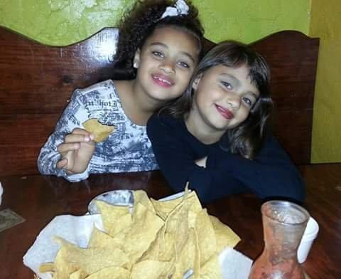 Kiki and Cici eating Tio's famous Salsa @ El Potro's