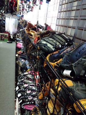 Racks filled with baseball gloves