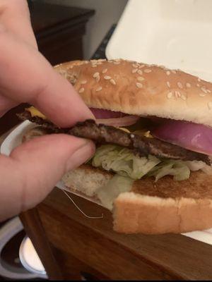 A single burger that suppose to be half pound