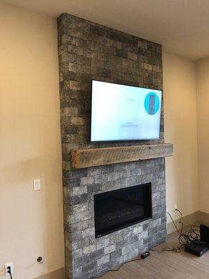 55" Samsung TV mounting on brick fireplace