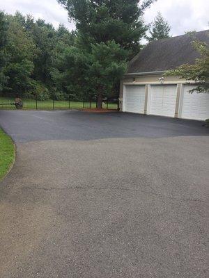 Driveway sealcoating