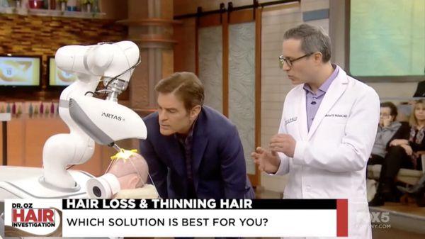 Dr. Wolfeld discussing robotic hair transplants with Dr. Oz