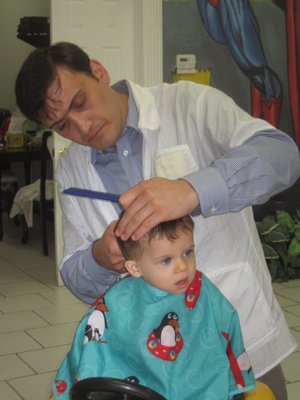 Isak cutting my grandson's first hair cut. Isak was very careful to insure experience was great to remember...grandson/grandparents/parents!