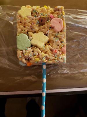 Rice Krispy treat unwrapped on a stick