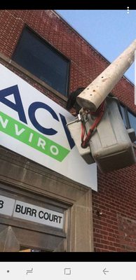 Here is the crew hanging a 5'x10' aluminum sign for Acv Enviro in Bridgeport CT.