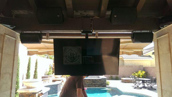 A gazebo setup with 2 TV's, 2 outdoor subwoofers, 2 bi-polar outdoor speakers, a receiver, and a subwoofer amplifier.