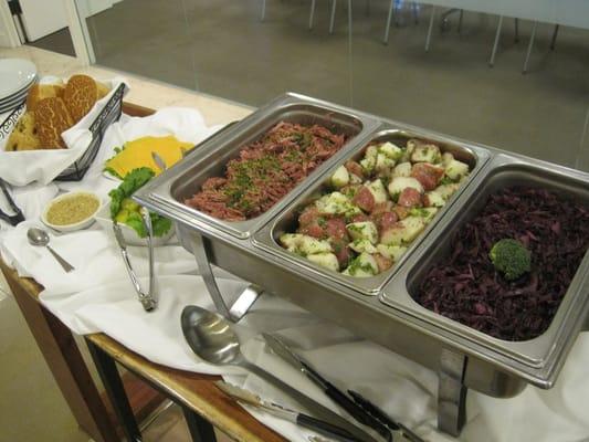 St. Patty's Day Lunch - Irish shredded corn beef sandwich served with cabbage, and warm red potato salad