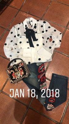 Rolling stone jeans with Paris dot blouse and dolce gabanba ish purse