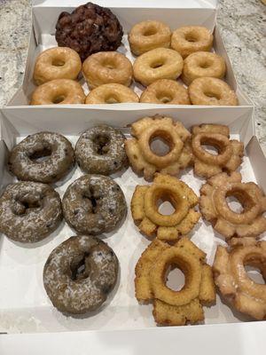 Apple fritter, glazed donuts, blueberry cake donuts  and old fashioned donuts.