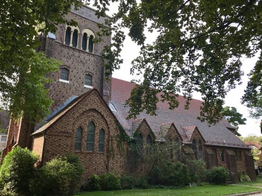 Look for the brick church with red roof among the beautiful homes of Forest Hills!