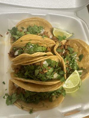 Five tacos Al pastor