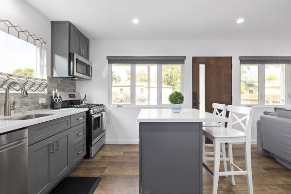 Complete Accessory Dwelling Unit Build. Kitchen area with center island for preparation assistance and dining.