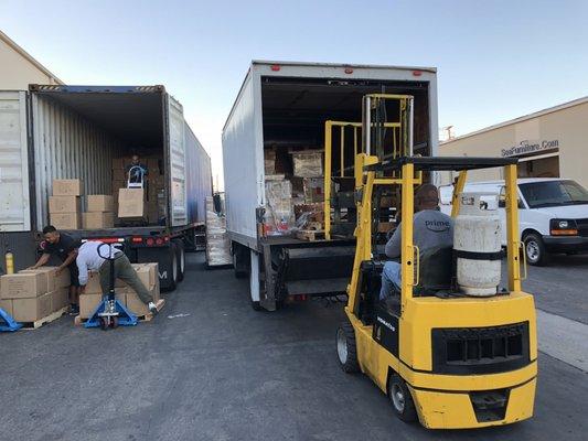 Unloading container and loading shipment going to Utah.