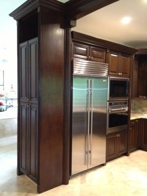 Kitchen with bullt in refrigerator and built in oven.