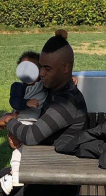 Random stranger holding my child during an outing at the park.