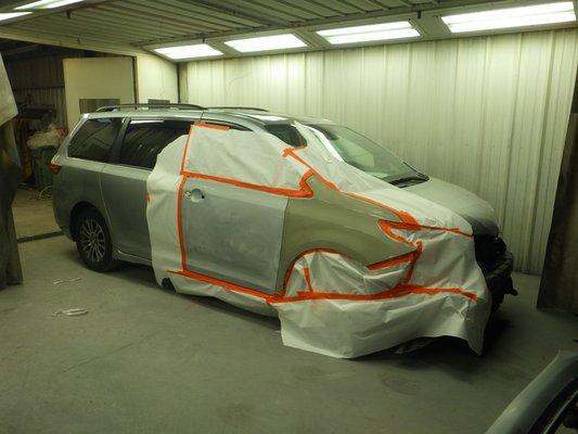 Vehicle undergoing refinish process