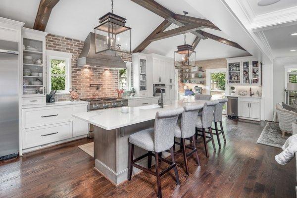 Open kitchen with 4 seat kitchen island, coffee bar area and bar area.