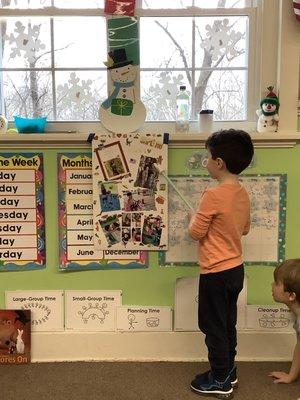 Presenting to the class about his family.