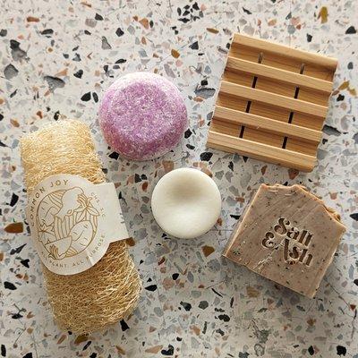 Solid body wash bar, shampoo and conditioner, and USA-grown and made bath accessories.