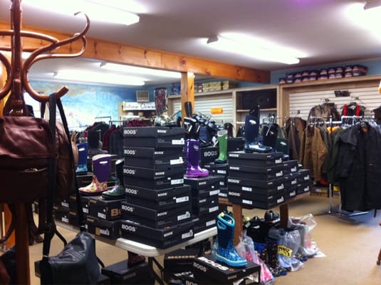 Assorted shoes and ski-related clothing