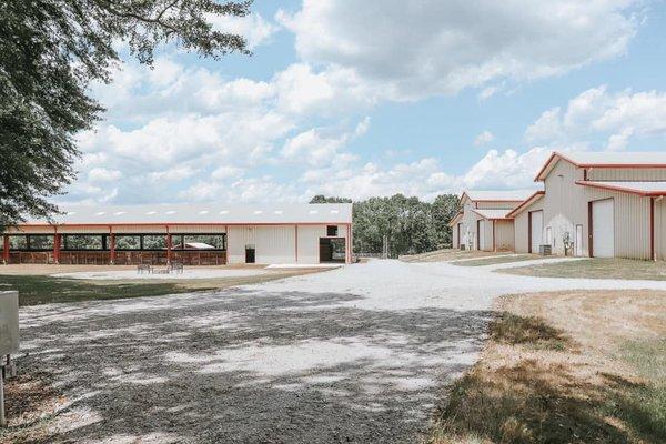 Our barn, covered arena, and sitting area.